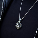 Sterling Silver Rotating Crescent & Wolf Symbol Necklace