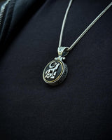 Sterling Silver Rotating Crescent & Wolf Symbol Necklace