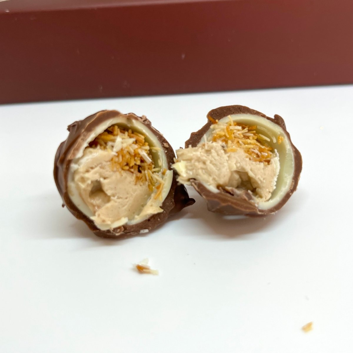 Ema Chocolate Milk and White Chocolate Truffles with Cinnamon Cream Filled - Merry Christmas Box - 250g - TryAladdin