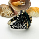 خاتم رجالي بحجر بيضاوي من الزمرد الأخضر