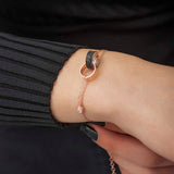 Rose Gold Tone Interlocking Circles Bracelet - Black Zirconia