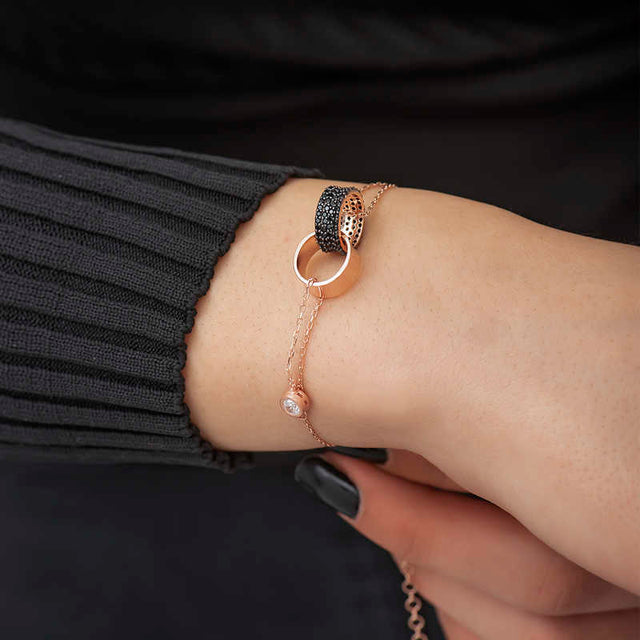 Rose Gold Tone Interlocking Circles Bracelet - Black Zirconia