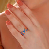 Rose Gold Tone Infinity Ring - Zirconia & Blue Enamel Detail