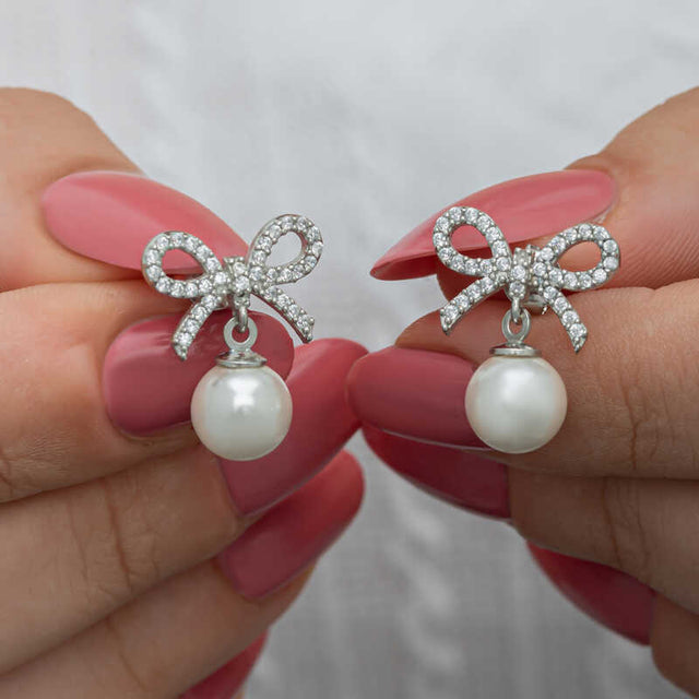 Stud Earrings - Sterling Silver Bow & Pearl Dangle Design