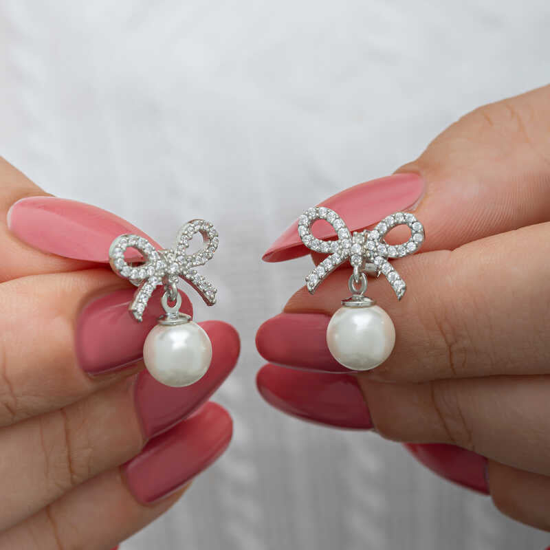 Stud Earrings - Sterling Silver Bow & Pearl Dangle Design