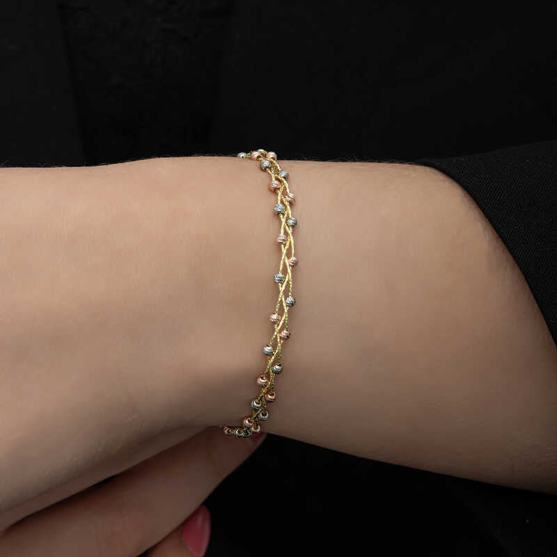 Armband – Goldfarbene, filigrane Multi-Ton Dorika Perlen mit gedrehtem Design