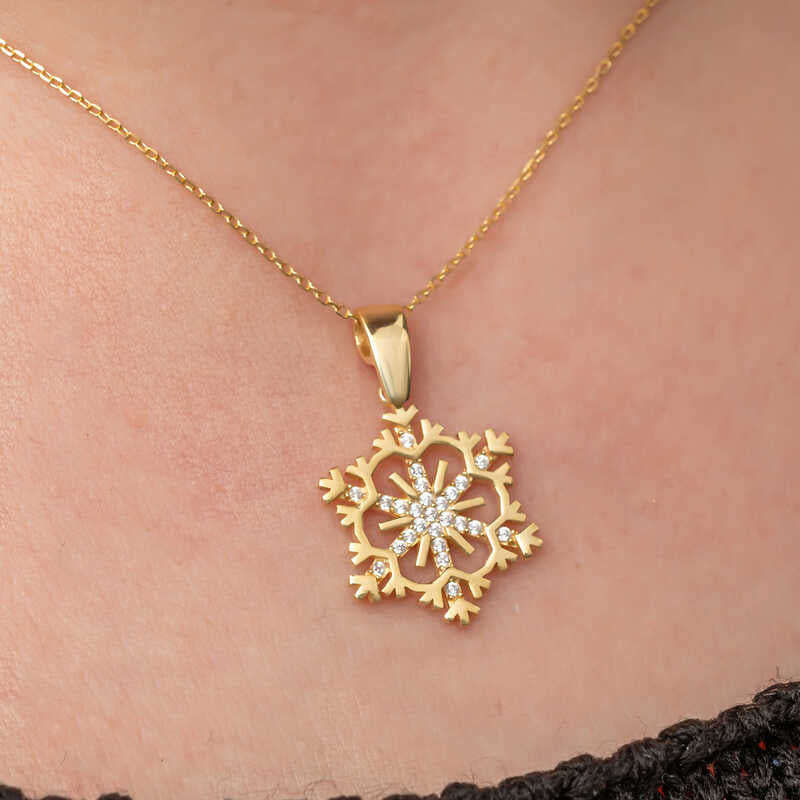 Collana - Ciondolo a forma di fiocco di neve in tono oro con zirconi cubici scintillanti